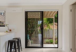 Kitchen breakfast bar and sliding door to the patio