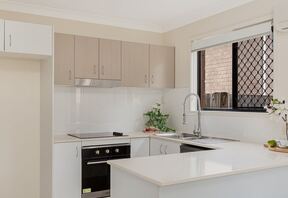 Kitchen with under-bench oven and cooktop