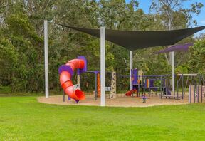 Playground and shaded seating in the complex parkland